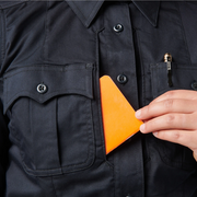 5.11 (62425) Close-up of zippered placket with melamine buttons and mic cord access at side seam. | The Fire Center