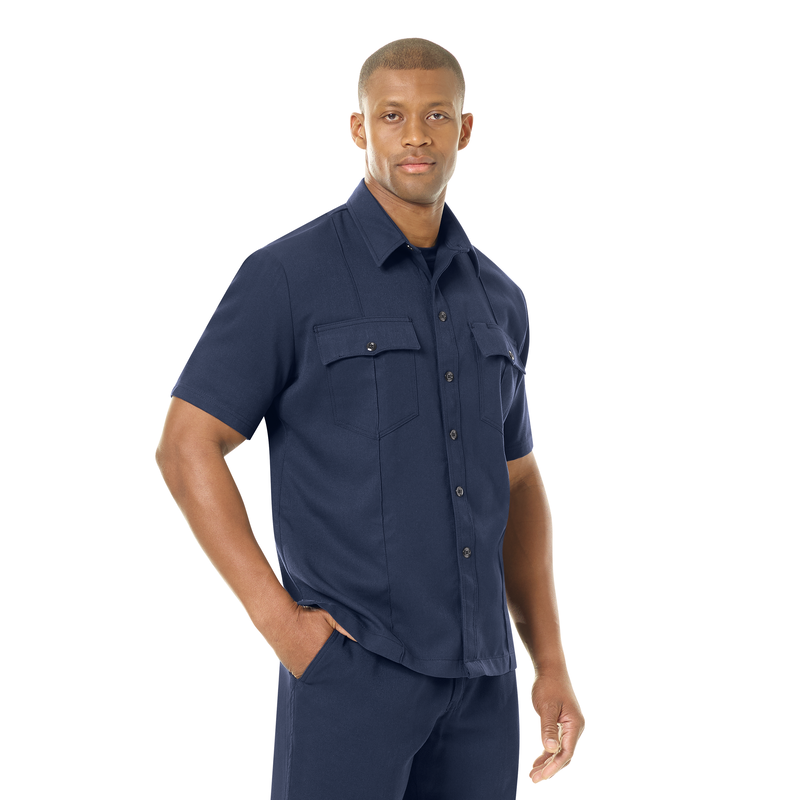 Introducing our new Station No. 73 Collection. Contemporary flame-resistant station wear built with functionality, comfort and NFPA® 1975 compliance in mind. Developed with extra features that enhance daily wear and fabric that more effectively wicks moisture from the skin to help reduce heat stress when things heat up. No badge tab. No epaulets. Straight bottom hem with side vents. Banded collar for professional appearance. 