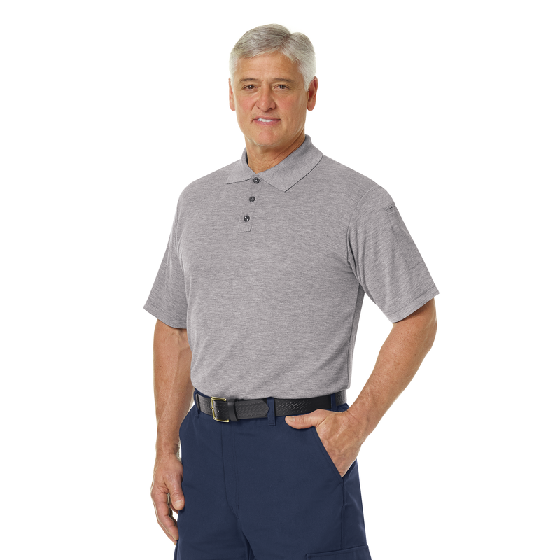 More protection. More benefits. More comfort. Our FR station wear classic short sleeve polo shirt made with Tecasafe® Plus Knit serves you better than cotton t-shirts with enhanced seam strength and fire service-specific features. Durable, comfortable, and cool. We've got you covered. Ribbed-knit collar. Hidden microphone pockets on both shoulders and pen pocket on left sleeve. Longer back hem helps stay tucked. Three button front placket with added mic loop.